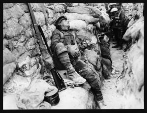 Soldier asleep in the trenches in World War One