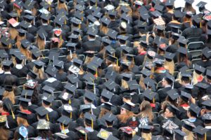 Aerial view of students wearing mortar boards at a graduation ceremony