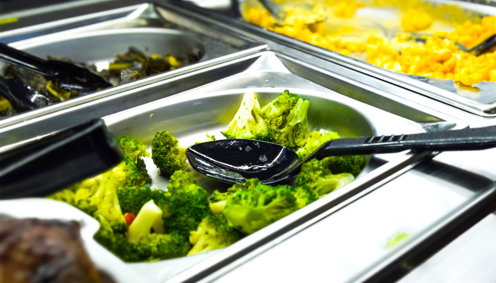 Food - Vegetables and macaroni cheese ready to be served in steel trays