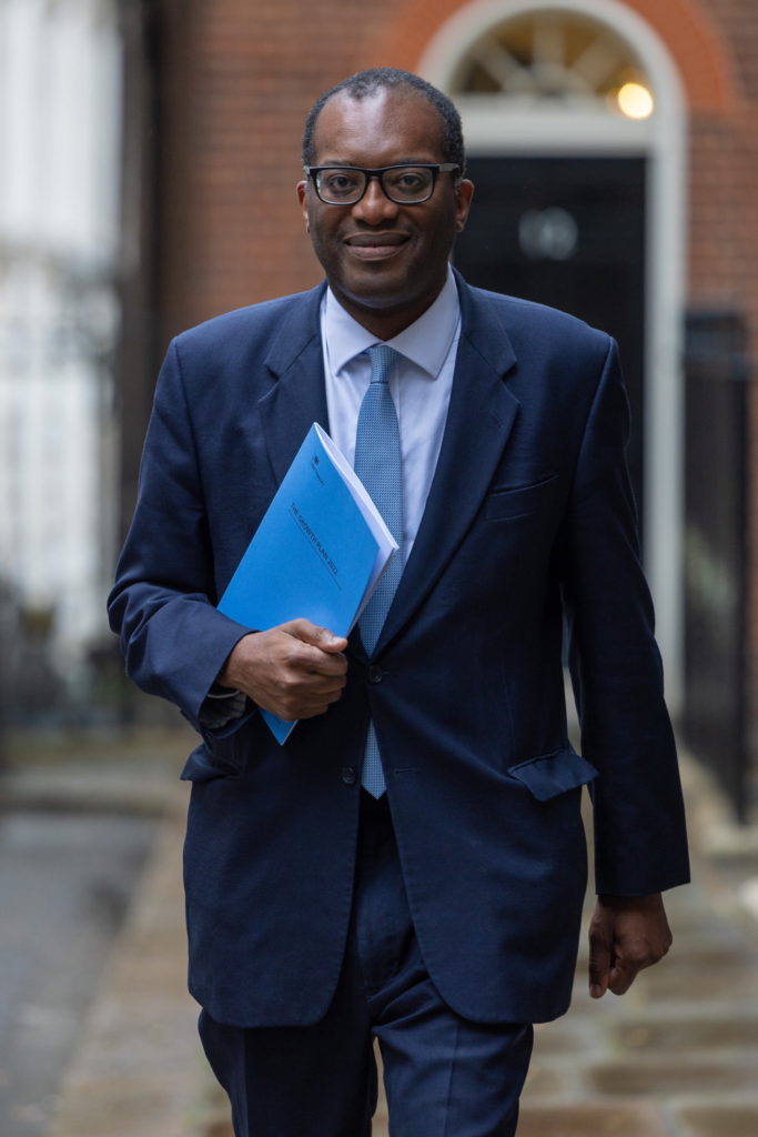Chancellor Kwasi Kwarteng holding a copy of booklet "The Growth Plan 2022"